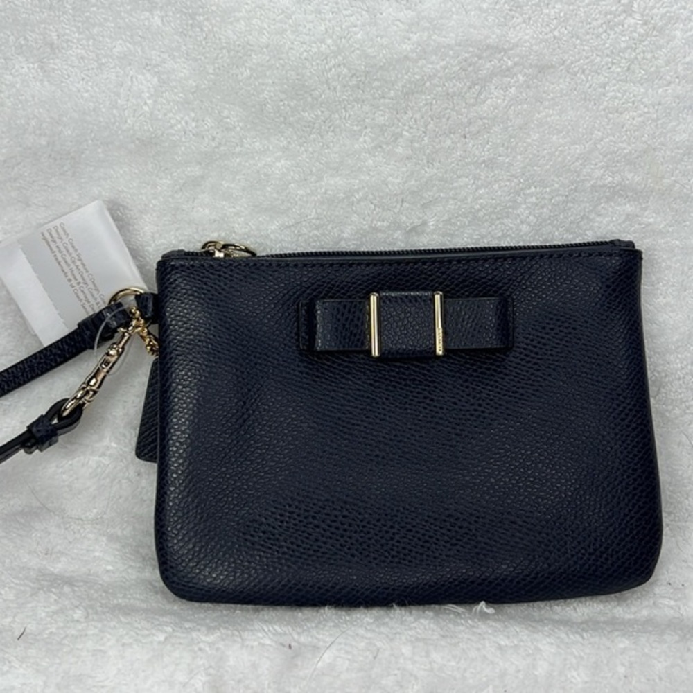 Coach NWT ,midnight, blue bow, wristlet gold hardware, comes with box
